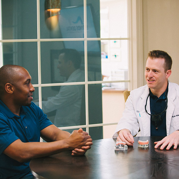 Dr. Ryan Ward speaking with a patient 
